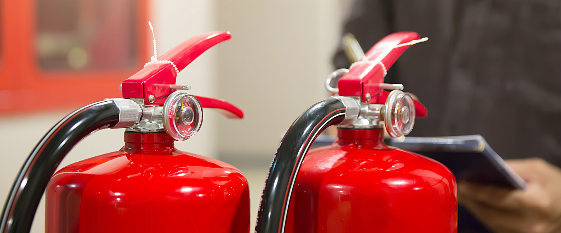 Engineer checking fire extinguishers