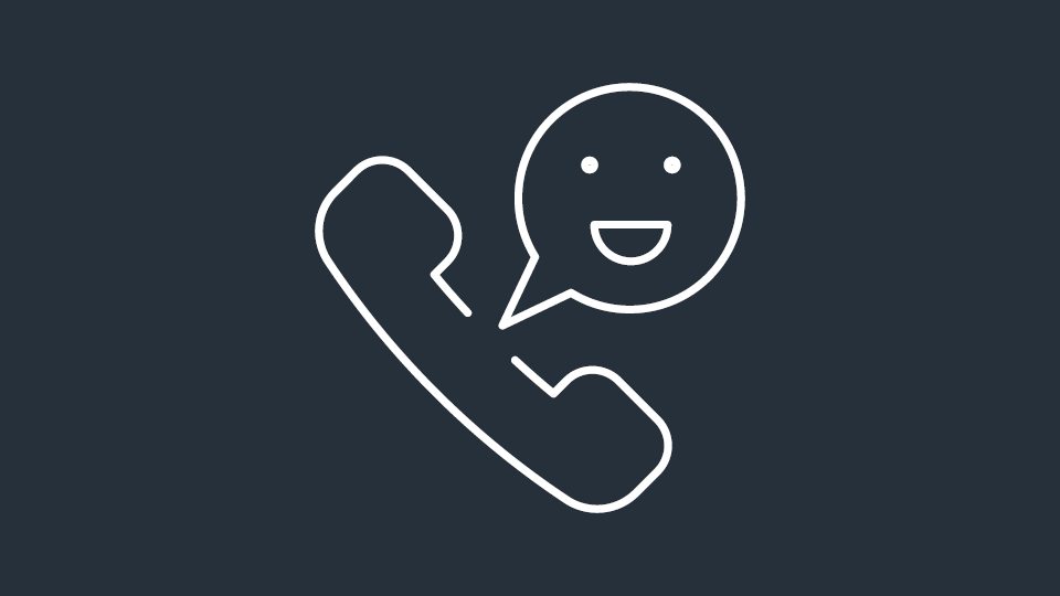 A white line icon of a telephone handset with a smiling speech bubble, on a dark blue background.