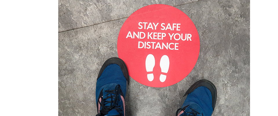 keep your distance sign on floor
