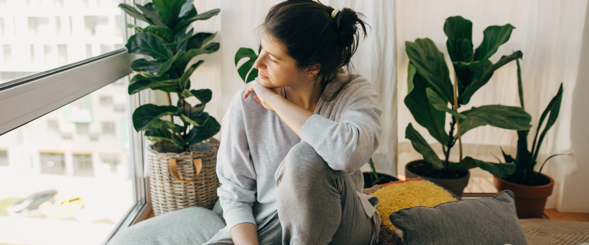 woman sat by her window