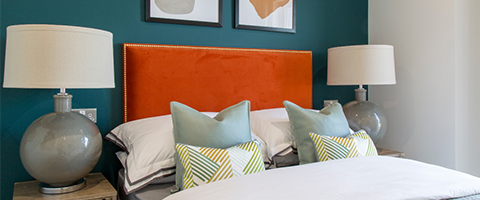 Bed with blue wall behind