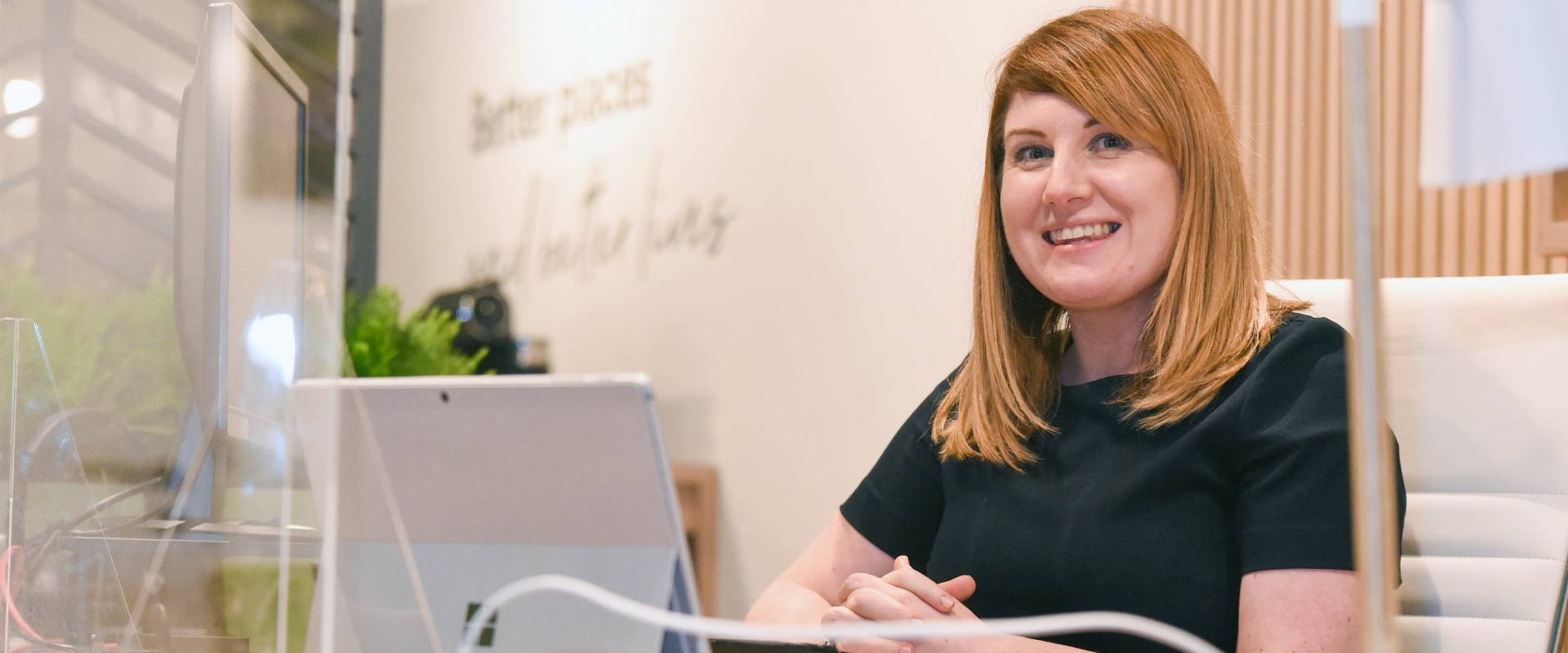 Woman working on computer at desk