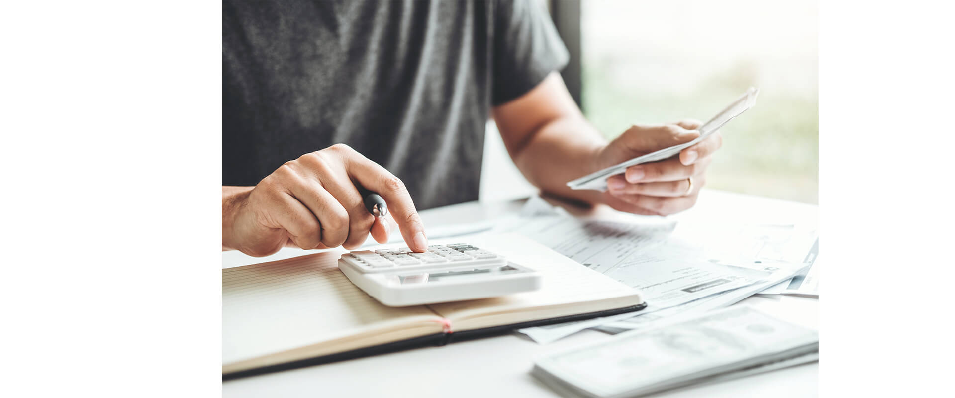 Man using a calculator