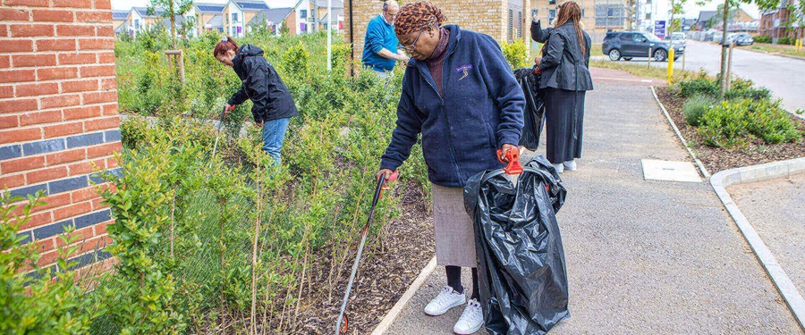 Residents and colleagues taking part in a community clean-up.