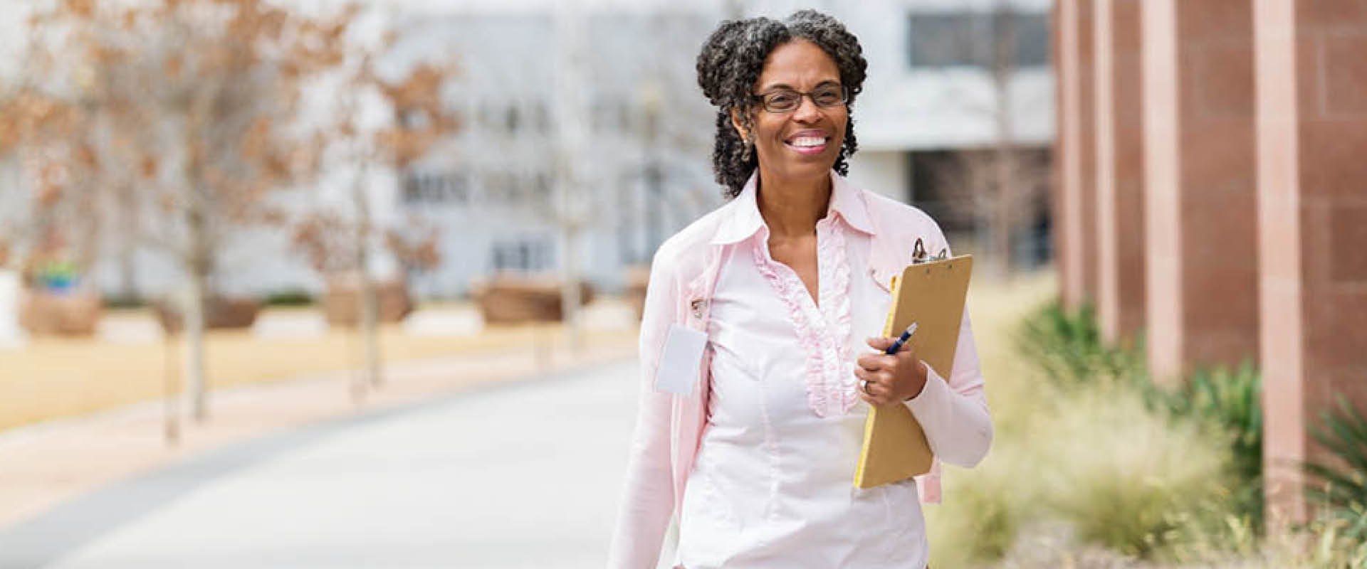 female resident walking and inspecting