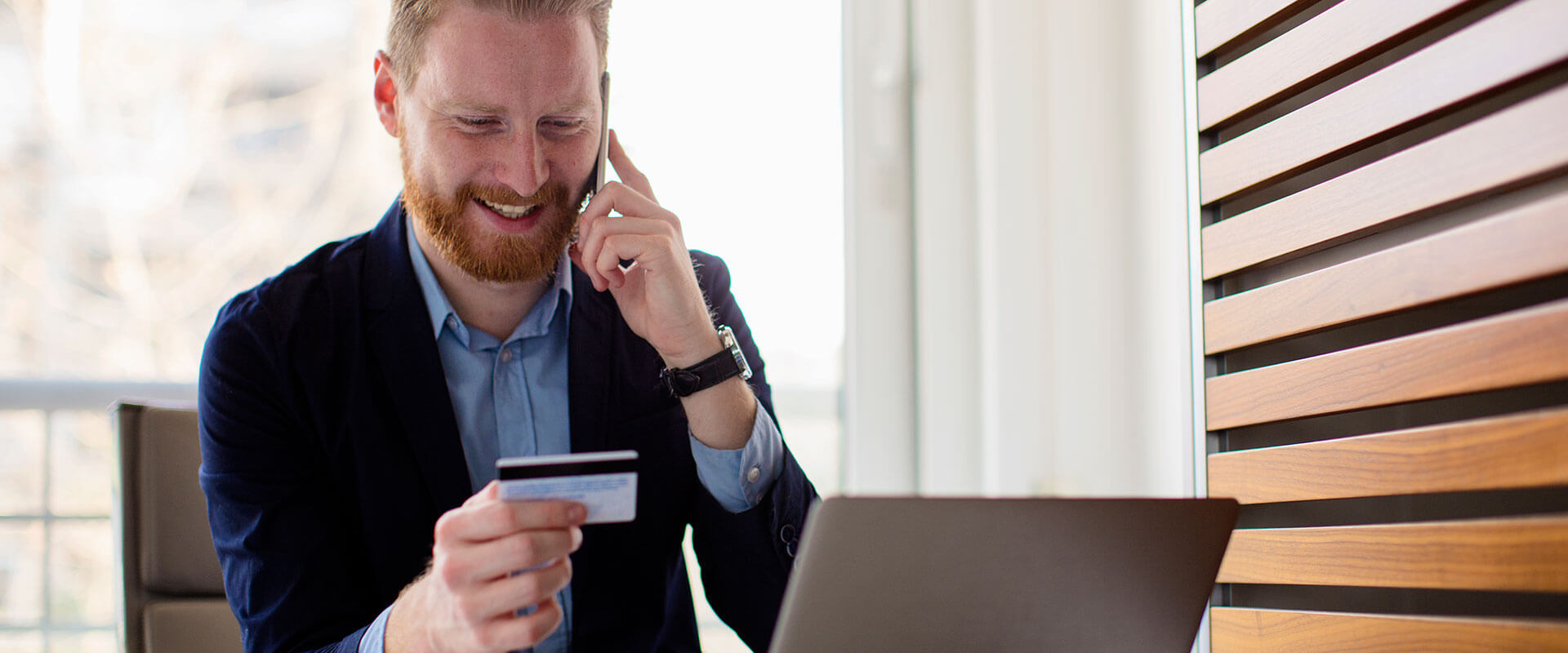 Man paying a bill over the phone