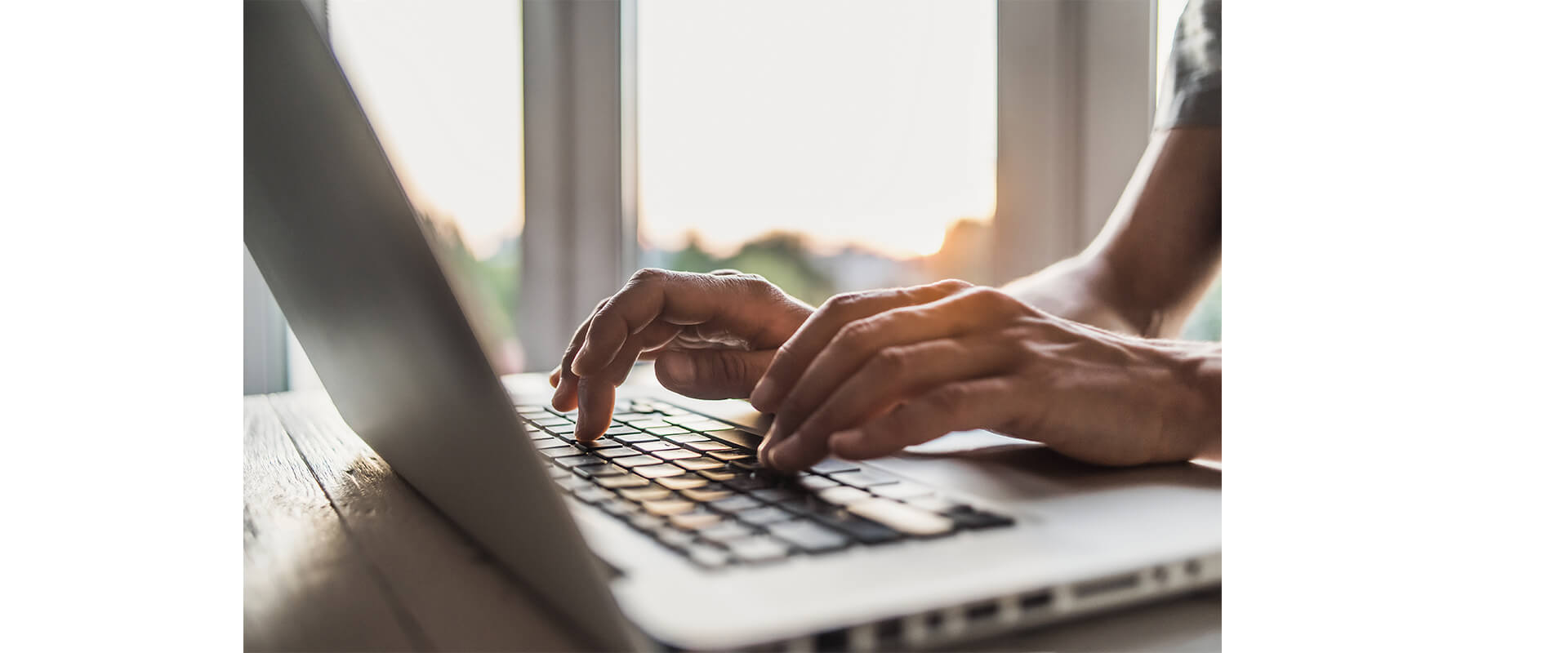 Man typing on laptop