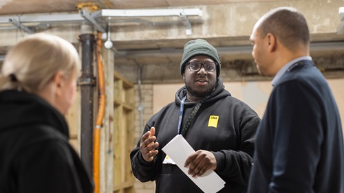 Joseph Fasogbon speaking with colleagues and mentors