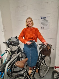 Person stood with a bike