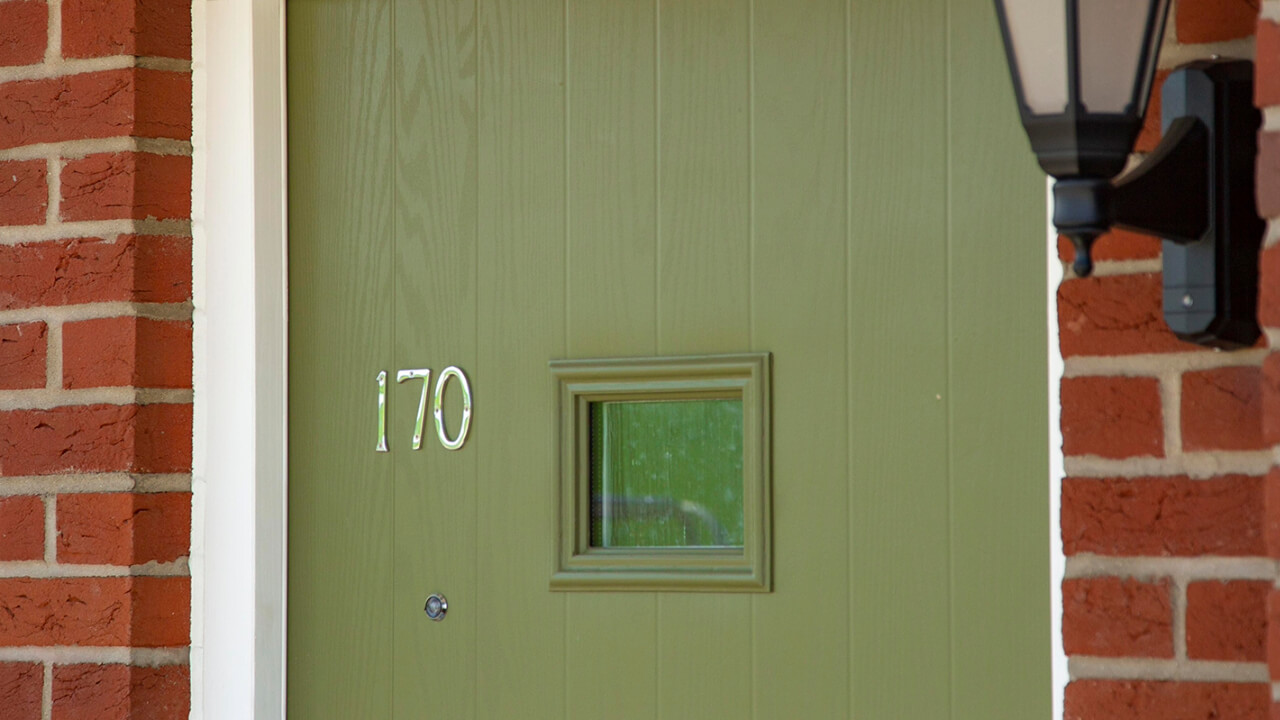 Close up of a green front door