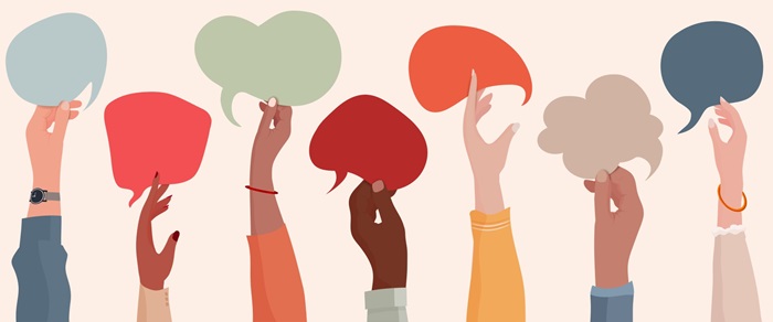 Simple flat illustration of different hands up in the air holding speech bubbles