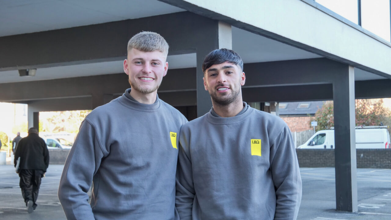 Two male L&Q colleagues stood together