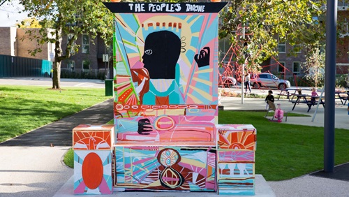 Colourful art sculpture, 'The People's Throne' by artist Adébayo Bolaji in Acton Gardens.