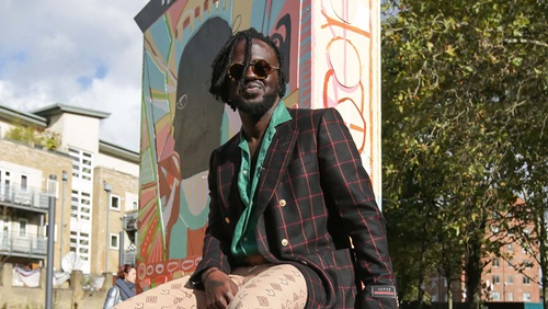 Artist, Adébayo Bolaji, sat on his art sculpture 'The People’s Throne'