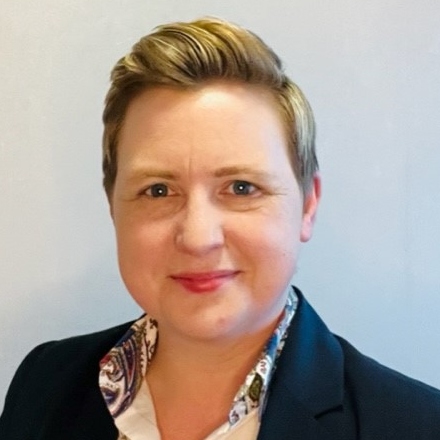 Portrait photo of a smartly dressed woman