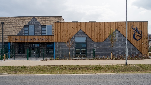 Outside shot of Beaulieu School, with a grey sky in the background