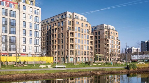 Modern riverside apartments at Brent Cross Town with sustainable design and green spaces.