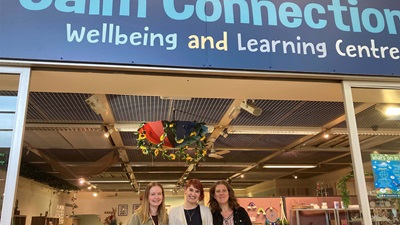 Outside of Calm Connections shop with two L&Q employees and CEO of Calm Connection, Emma Lenihan stood outside.