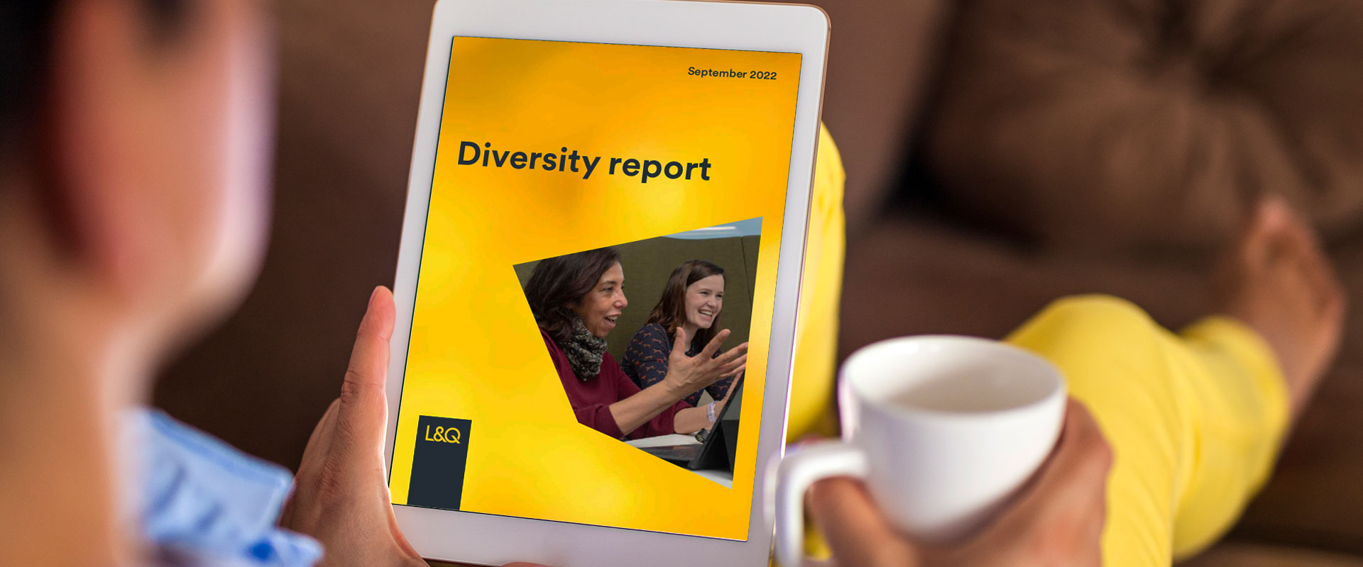 A woman looking at L&Q's Diversity report on a tablet device