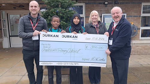 Representatives from Durkan present Gallion's Primary School with a £300 donation check.