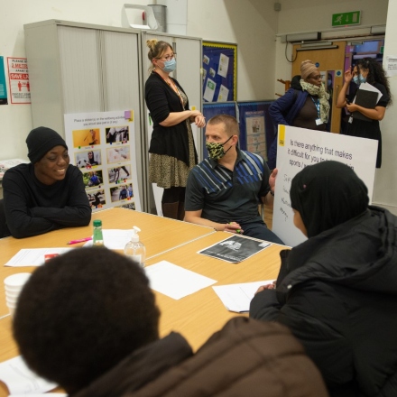 Group of people working in a classroom