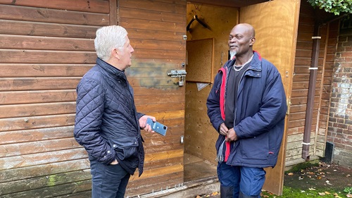 Neighbourhood Housing Lead Ian Henderson speaking with caretaker in gardens