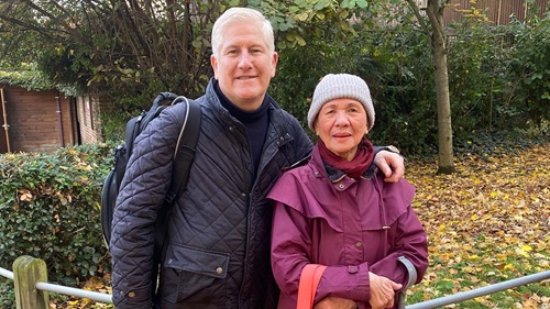 Neighbourhood Housing Lead Ian Henderson stood with resident Lolita Delos-Santos