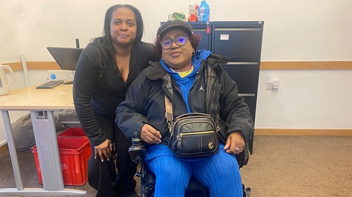 Neighbourhood housing lead providing support to resident at Winsor Park community centre, promoting accessibility and wellbeing.