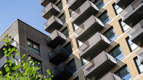 Exterior view of the Kew Bridge Rise residential building with balconies.