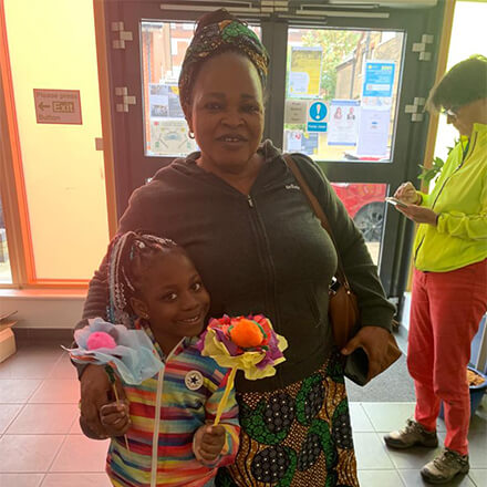 A mother and daughter smiling