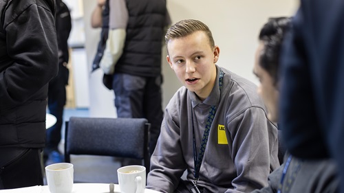 L&Q apprentice speaking with colleagues