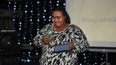 Degmo Mohamed with her L&Q Living Responsibility Award 