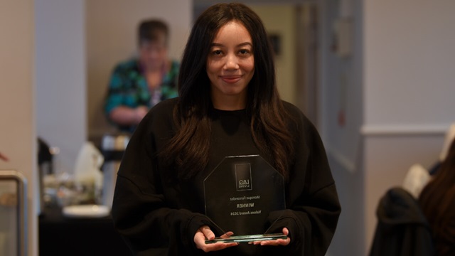 Monique Fernandez holding her L&Q Living Value Award