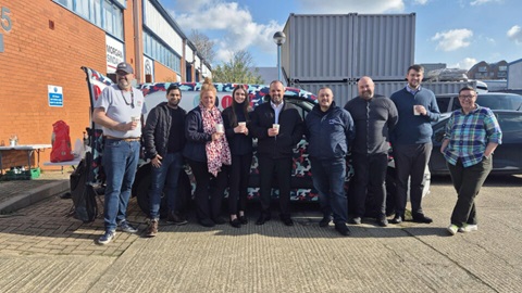 Team enjoying coffee from Combat2Coffee van outside Morgan Sindall office