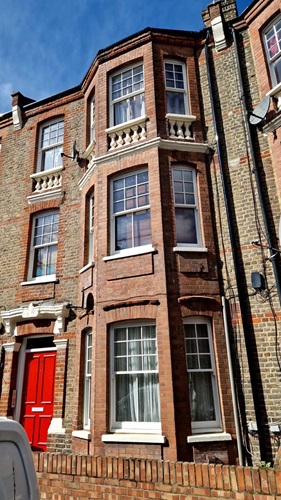 Outside of building where Ms Thomas's lives showing the new windows that have been installed