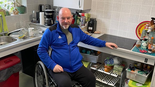 Ian Ricketts sat in his wheelchair at his accessible kitchen