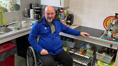 Ian Ricketts sat in his wheelchair at his accessible kitchen