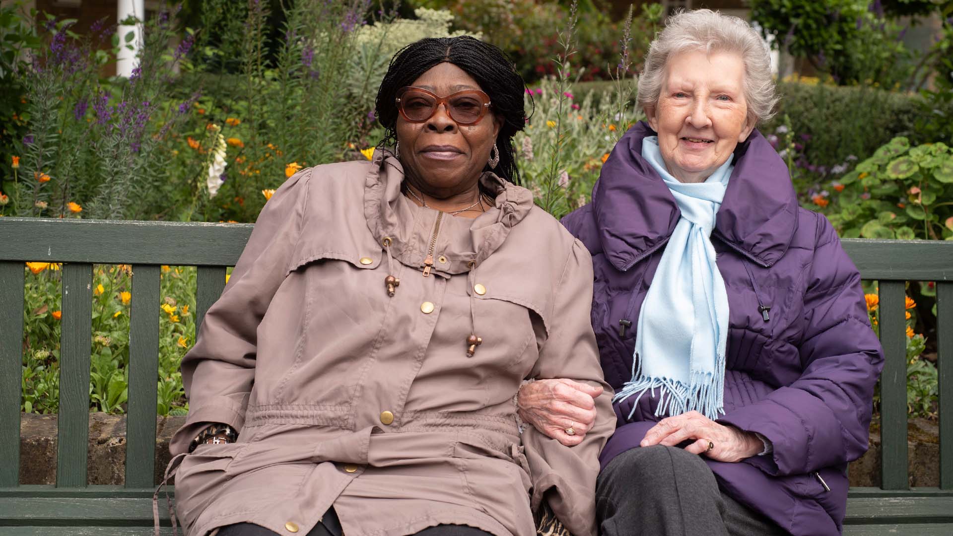 Two Woodstock court residents sat next to each other on a long bench