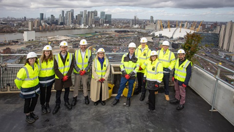 Group in hard hats at Prime Point construction site, Greenwich Peninsula
