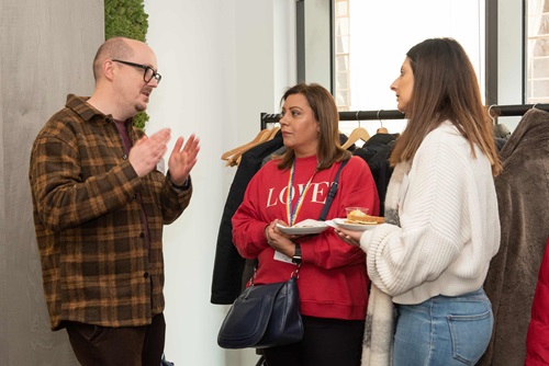 Three people stood speaking together at Spectrum conference