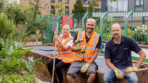 Volunteers working on raised planting beds in the Walthamstow Stadium community garden.