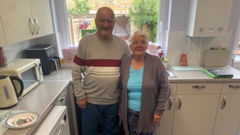 Trevor and Elizabeth Prior stood in their kitchen 