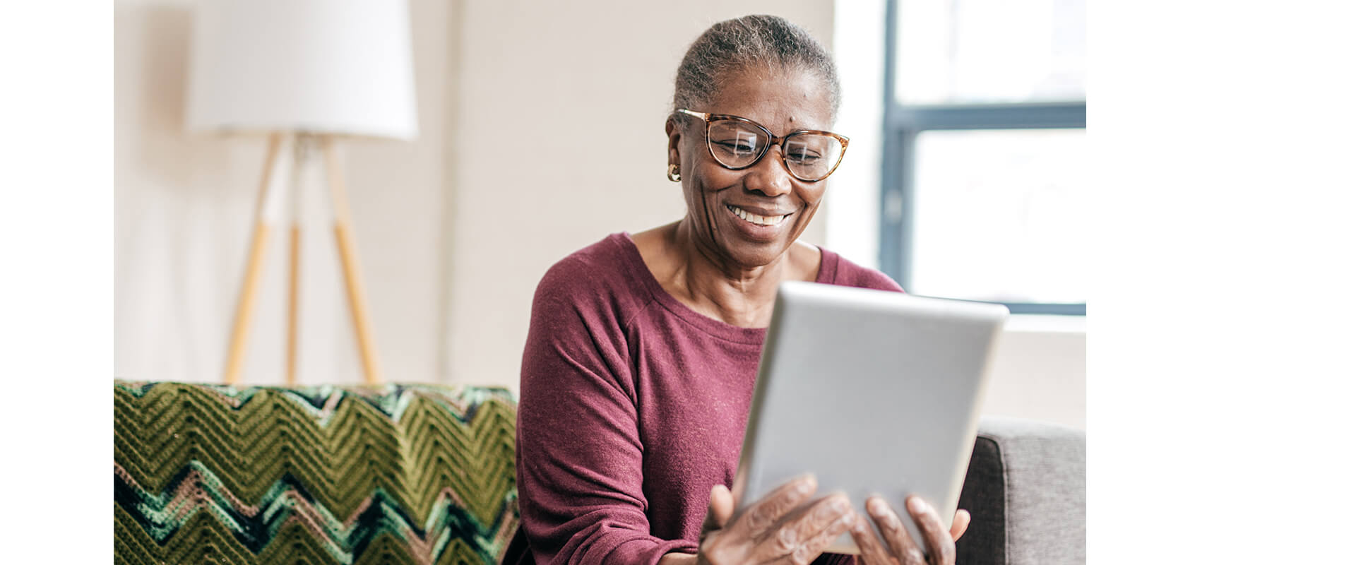 woman looking at tablet