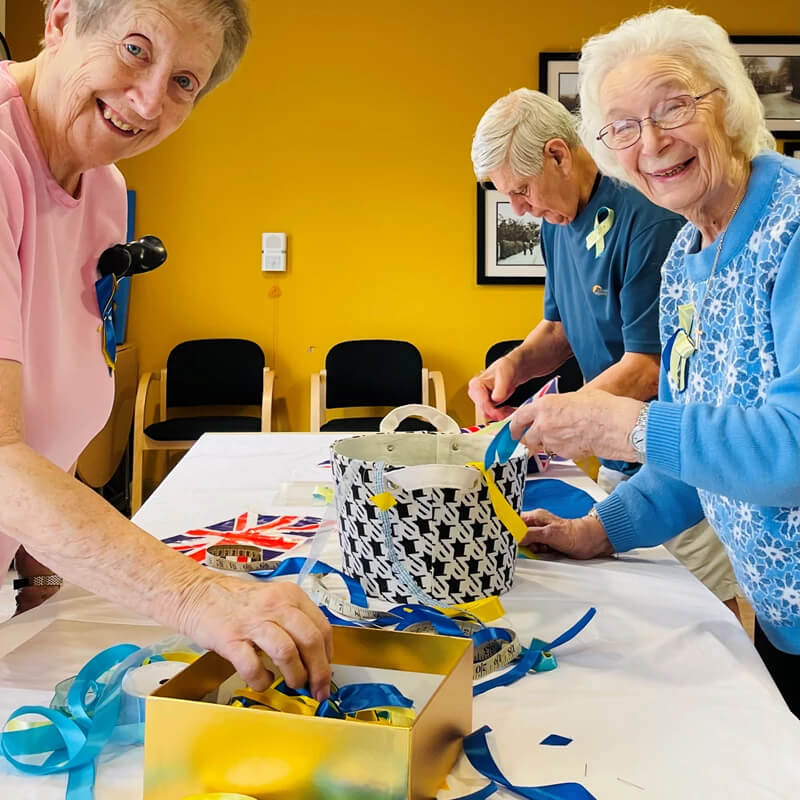 Elderly people doing arts and crafts