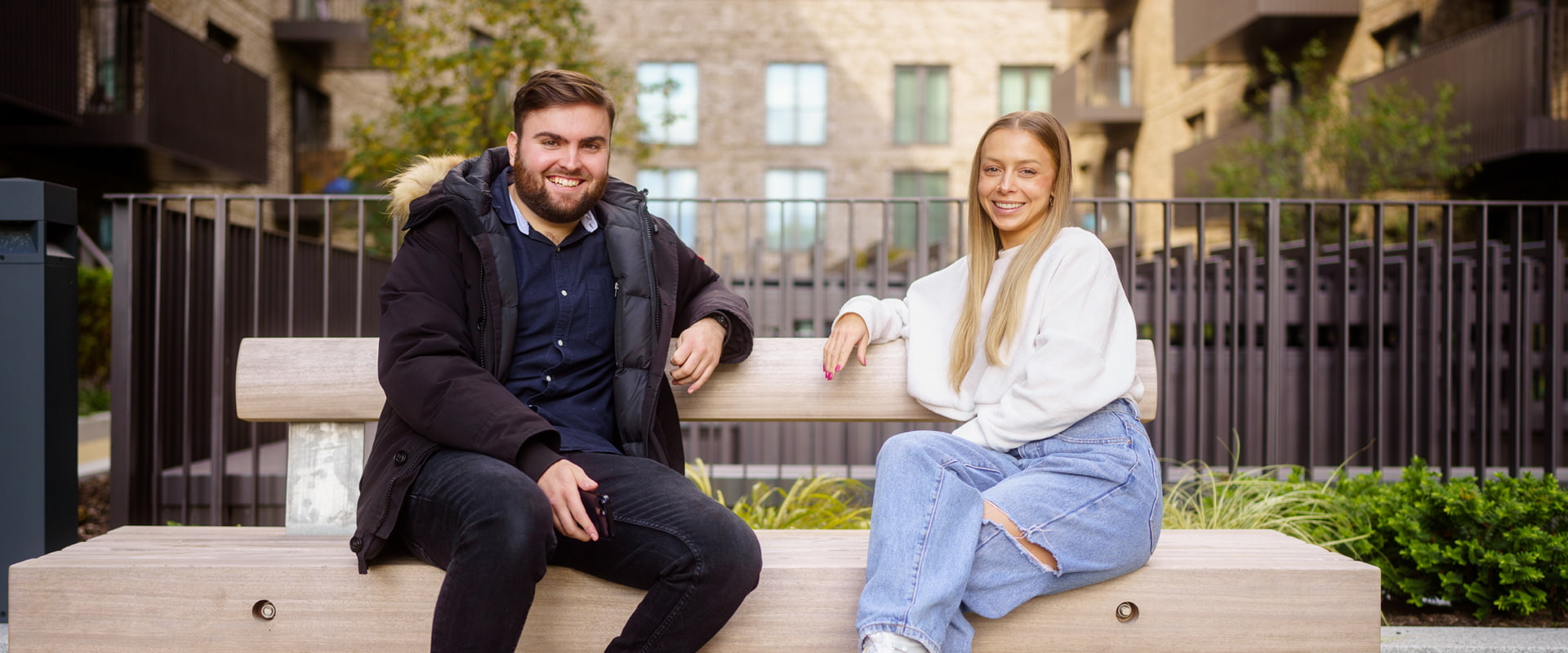 A man and woman sat on a bench